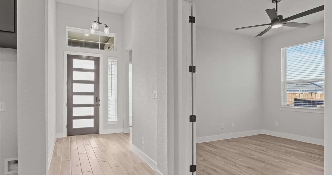 Representative unfurnished interior of a home built from the Summerton by Chesmar Homes in Village at Three Oaks, Seguin (Image 7).