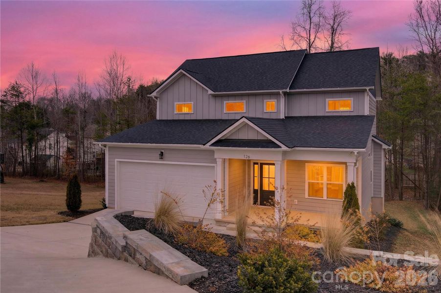 Front exterior of a new home in , Troutman, NC, highlighting curb appeal (Image 13).