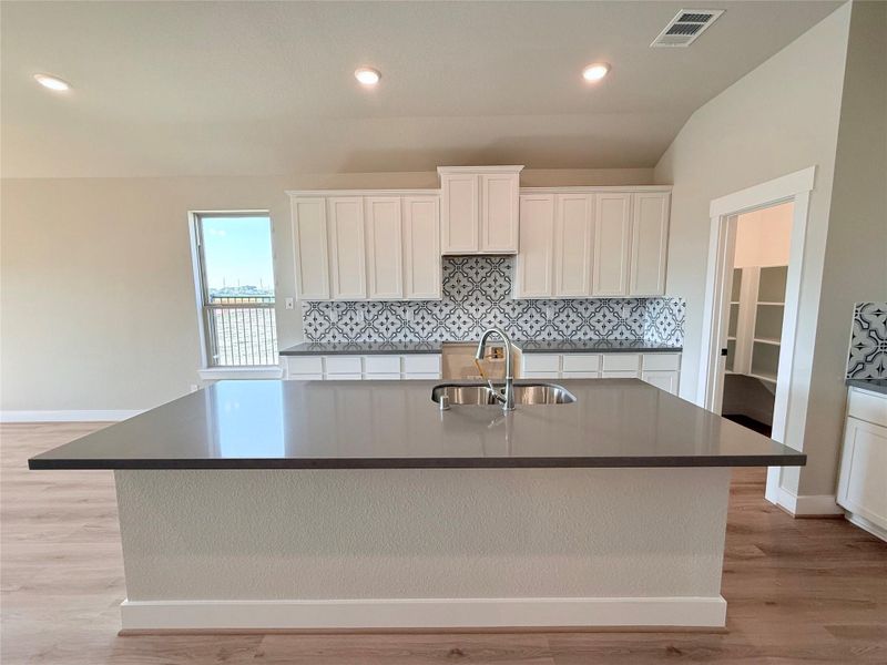 Furnished interior view inside a new home in Sunterra, Katy (Image 8).
