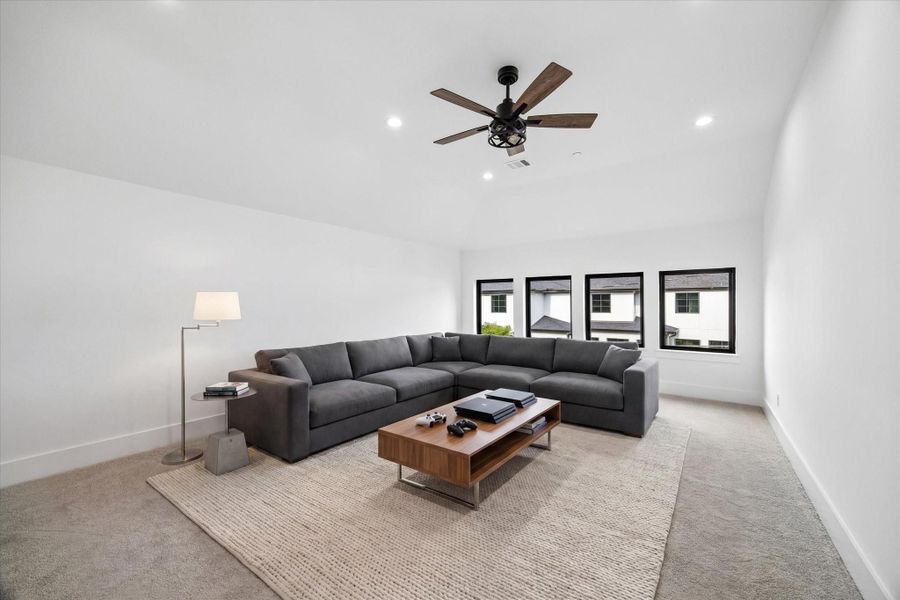 The enormous high ceiling Game Room measures 15x20 (virt. staged)