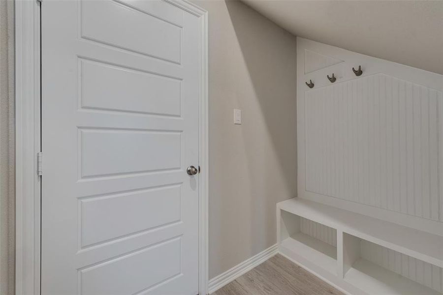 Mudroom featuring light wood-type flooring