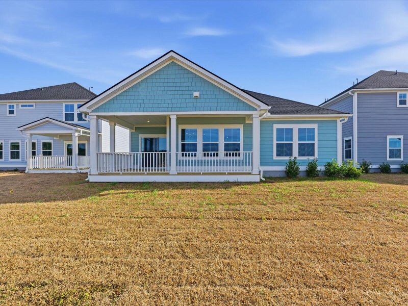Exterior details and patio area of a home in The Coves at Lakes of Cane Bay, Summerville (Image 29).