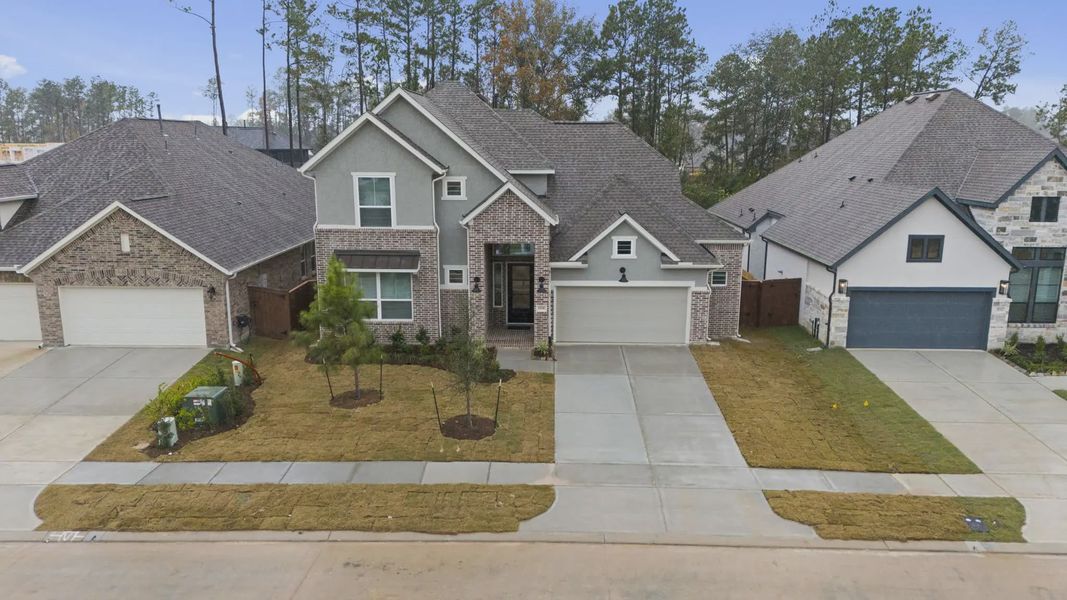Front exterior of a new home in Evergreen, Fulshear, TX, highlighting curb appeal (Image 25).