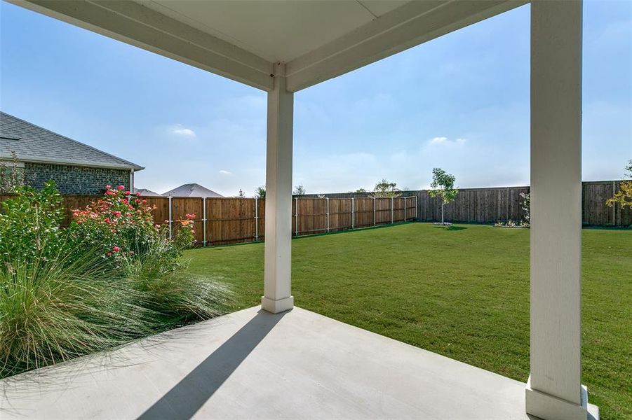 Exterior details and patio area of a home in The Preserve, Justin (Image 20).