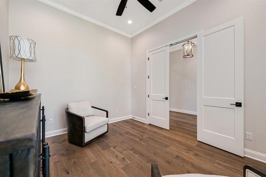 Unfurnished room featuring crown molding, ceiling fan, dark wood finished floors, and recessed lighting Unfurnished room featuring crown molding, ceiling fan, dark wood finished floors, and recessed lighting