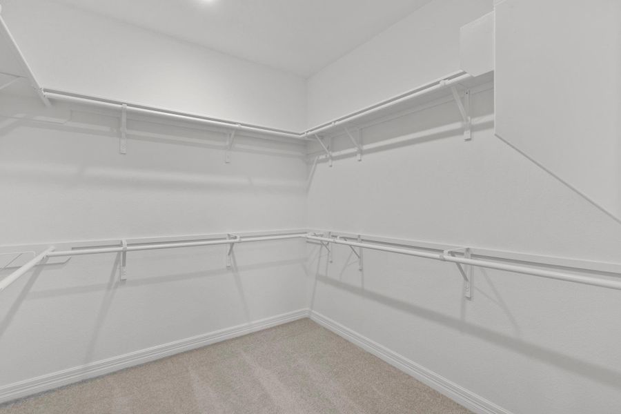 A view of your large primary walk-in Closet