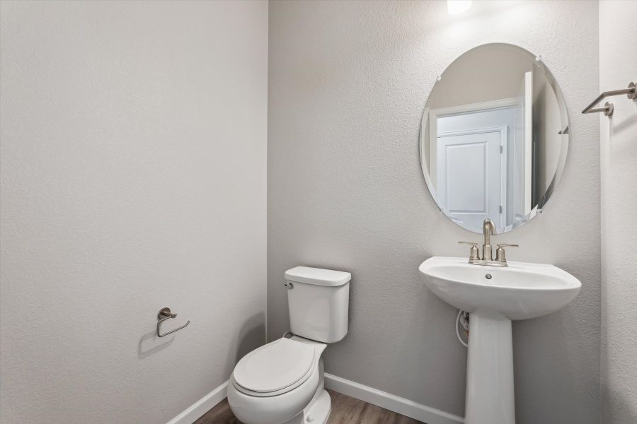 A bathroom with a sink and toilet. A bathroom with a sink and toilet.