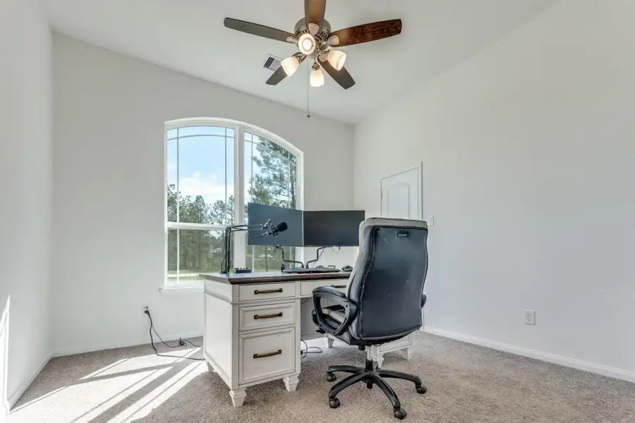 Furnished interior view inside a new home in Deer Pines, Conroe (Image 8).