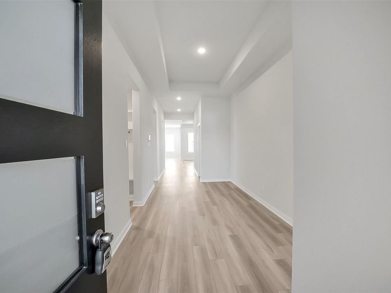 Spacious, unfurnished interior of a new home in Sunterra, Katy (Image 23).