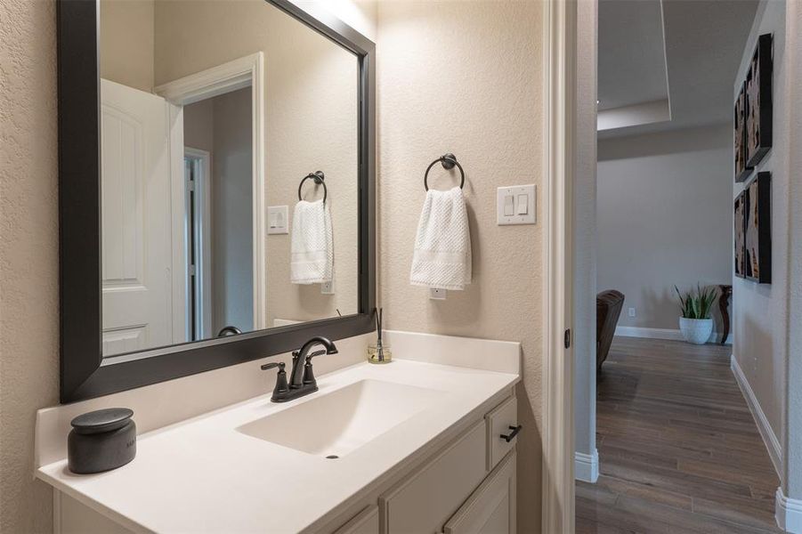 Vanity with custom mirror and cabinet hardware