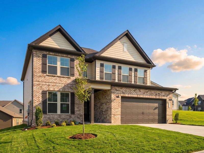 Front exterior of a new home in Woods Crossing, Gallatin, TN, highlighting curb appeal (Image 2). Front exterior of a new home in Woods Crossing, Gallatin, TN, highlighting curb appeal (Image 2).