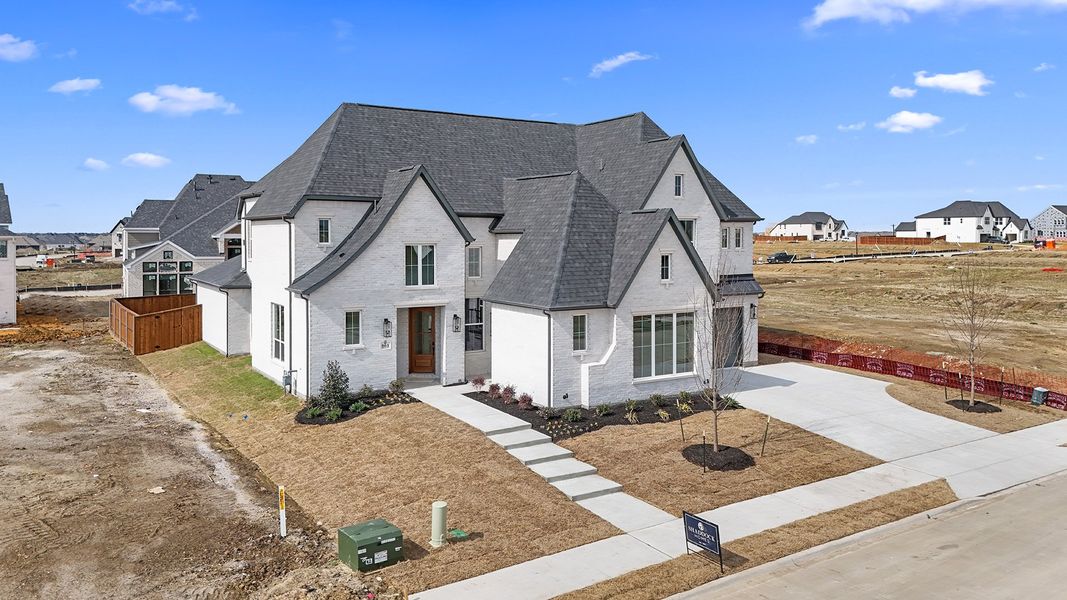 Front exterior of a new home in Park Place - 80' Lots, Prosper, TX, highlighting curb appeal (Image 28). Front exterior of a new home in Park Place - 80' Lots, Prosper, TX, highlighting curb appeal (Image 28).