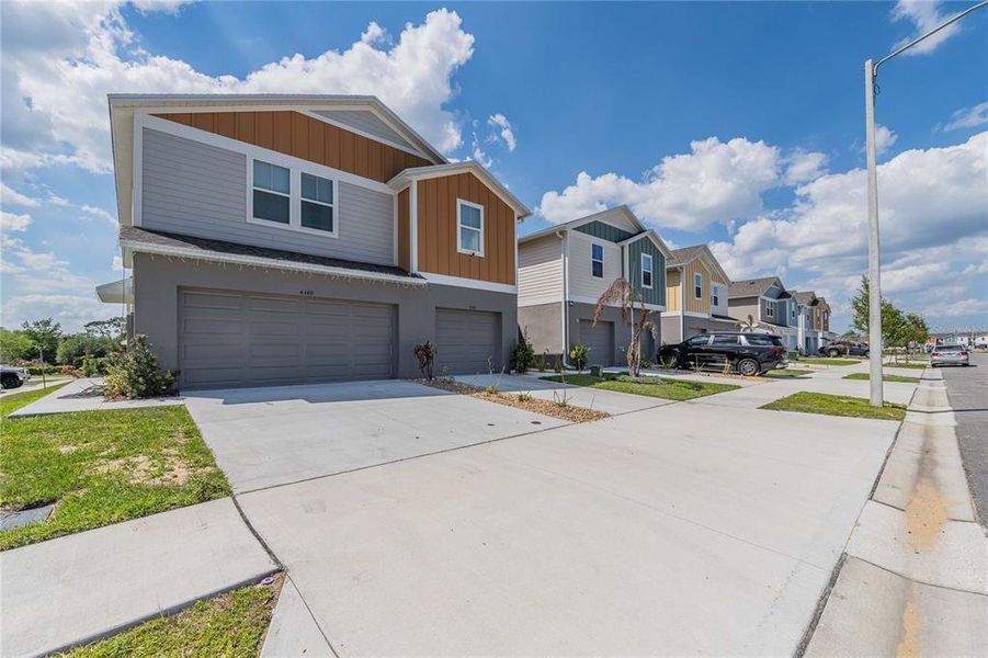 Front exterior of a new home in , Haines City, FL, highlighting curb appeal (Image 23). Front exterior of a new home in , Haines City, FL, highlighting curb appeal (Image 23).