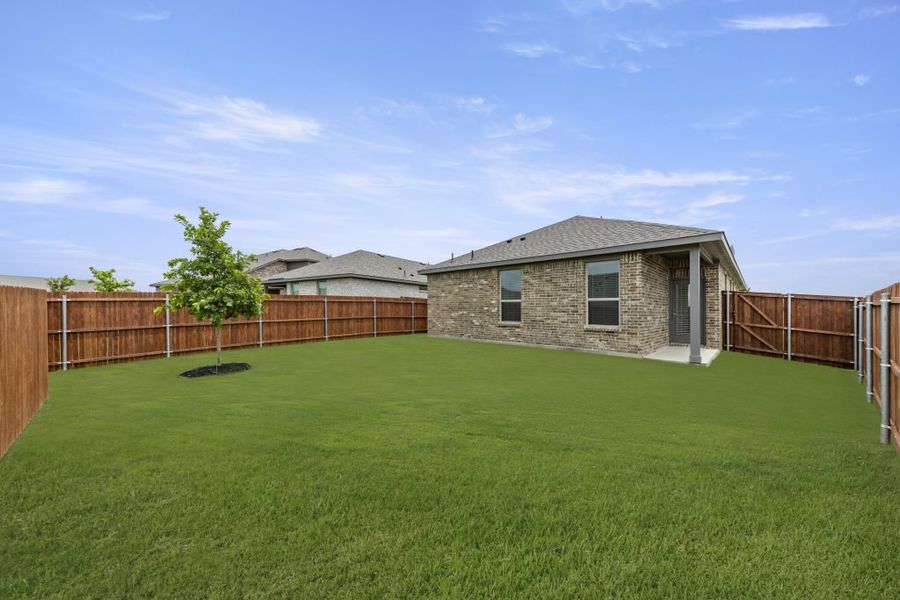 Representative exterior photo of a completed home built from the Cottonwood by Impression Homes in Northspur, Terrell, TX (Image 25).