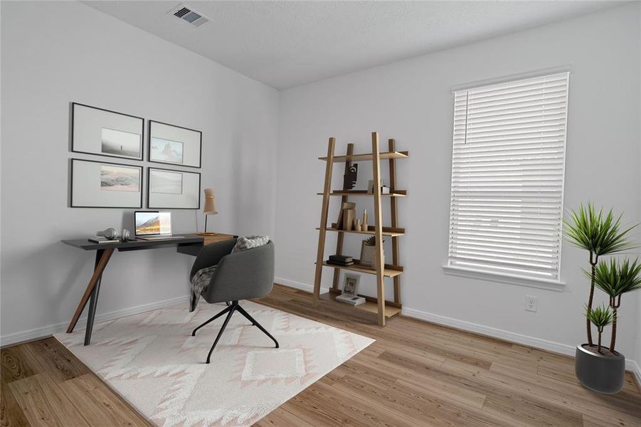 Quietly nestled in front of the home is the handsome den that can be used as an office, play room, dining room, or whatever your hearts desire. Featuring vinyl plank flooring, high ceilings, large windows with privacy blinds and neutral paint.