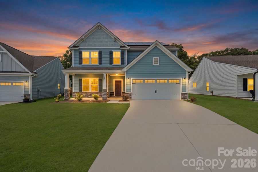 Front exterior of a new home in The Glenns II, Wingate, NC, highlighting curb appeal (Image 2). Front exterior of a new home in The Glenns II, Wingate, NC, highlighting curb appeal (Image 2).
