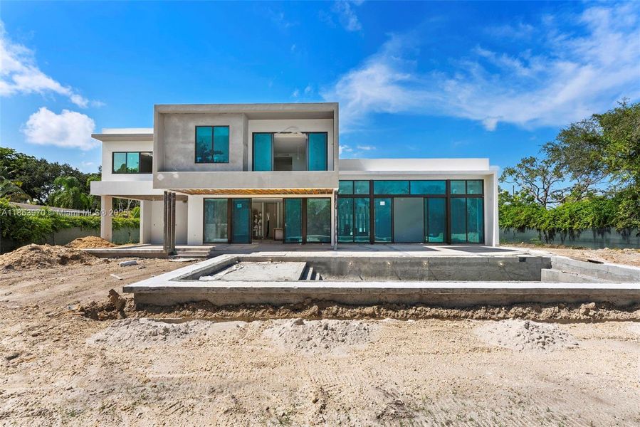 Front exterior of a new home in , Pinecrest, FL, highlighting curb appeal (Image 28). Front exterior of a new home in , Pinecrest, FL, highlighting curb appeal (Image 28).