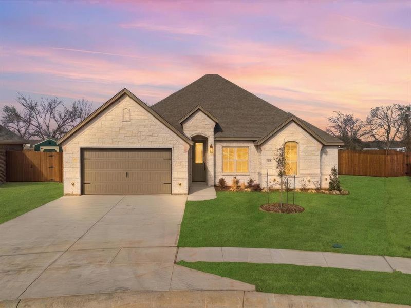 Front exterior of a new home in , Springtown, TX, highlighting curb appeal (Image 1). Front exterior of a new home in , Springtown, TX, highlighting curb appeal (Image 1).