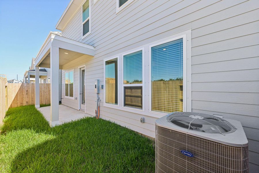Exterior details and patio area of a home in Kemah Crossing - Luxe Series, Kemah (Image 3). Exterior details and patio area of a home in Kemah Crossing - Luxe Series, Kemah (Image 3).