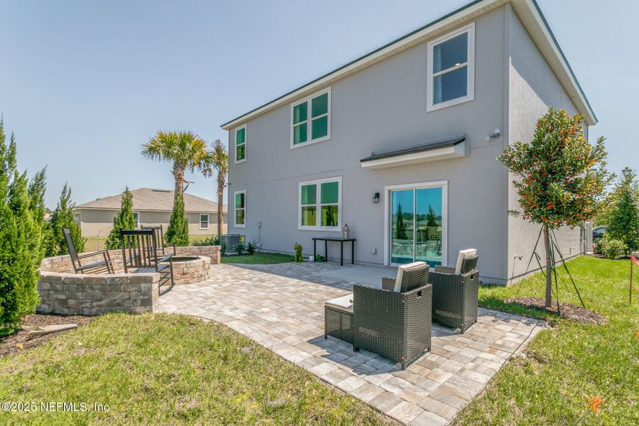 Exterior details and patio area of a home in Sawmill Branch, Palm Coast (Image 2).
