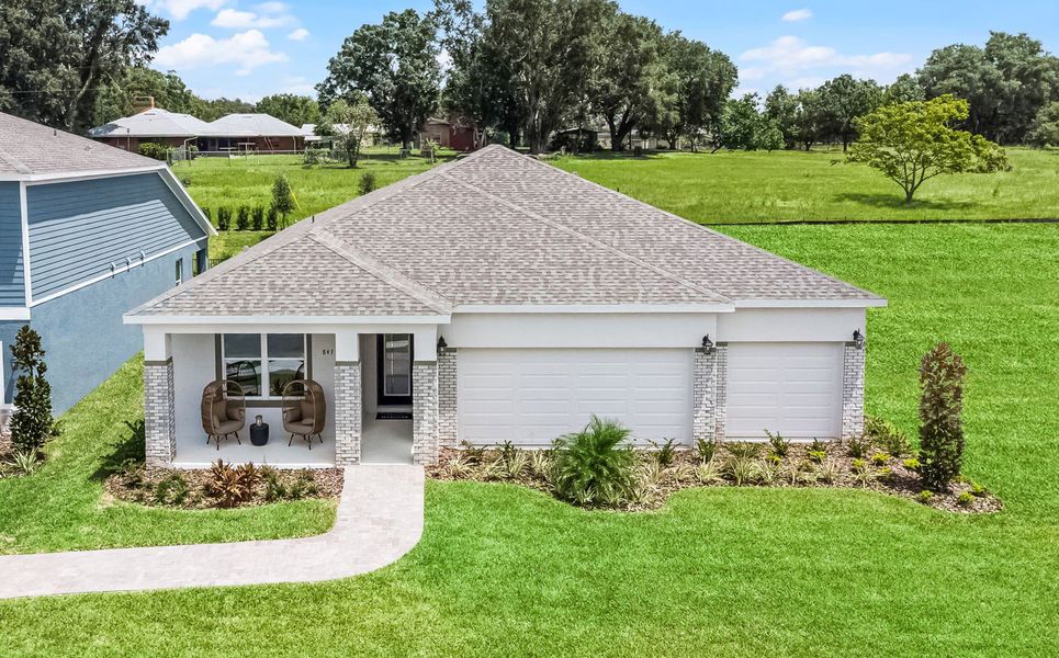 Representative exterior photo of a completed home built from the Everly by Hartizen Homes in Eden Crest Single Family Homes, Apopka, FL (Image 28).