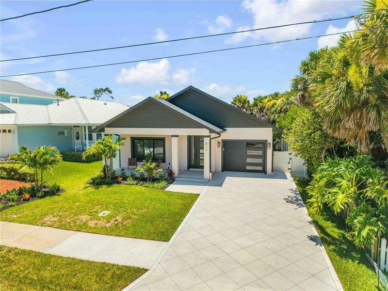 Front exterior of a new home in , New Smyrna Beach, FL, highlighting curb appeal (Image 33). Front exterior of a new home in , New Smyrna Beach, FL, highlighting curb appeal (Image 33).