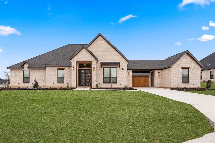 This is an example of the Garza built at 130 Texas Ash Drive. The construction on this home is set to be complete in July 2025.