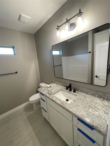 Bathroom with vanity and toilet