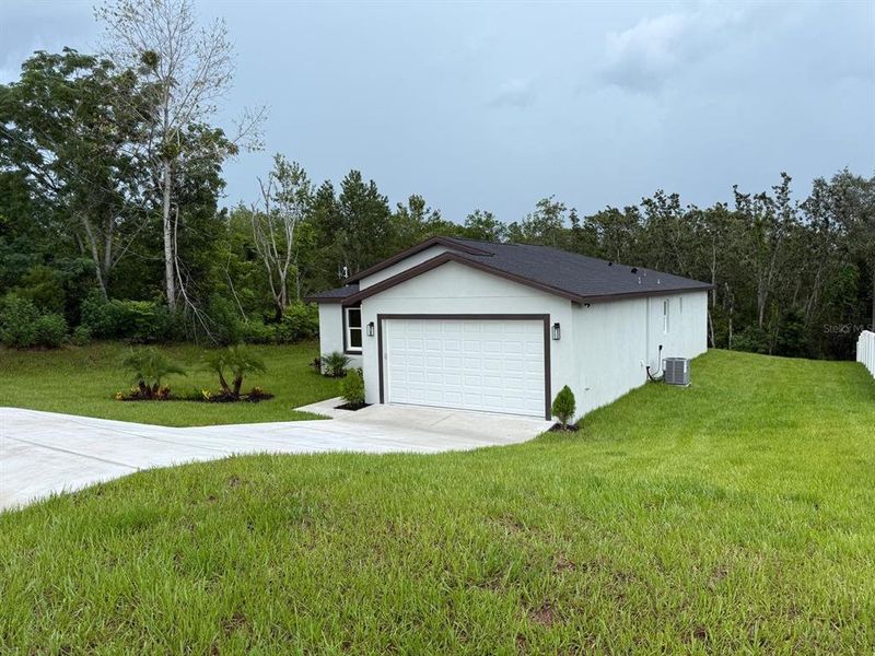 Front exterior of a new home in , Spring Hill, FL, highlighting curb appeal (Image 26). Front exterior of a new home in , Spring Hill, FL, highlighting curb appeal (Image 26).