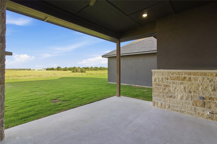 Enjoy countryside tranquility from this property's welcoming patio, offering verdant views and abundant open space. Enjoy countryside tranquility from this property's welcoming patio, offering verdant views and abundant open space.