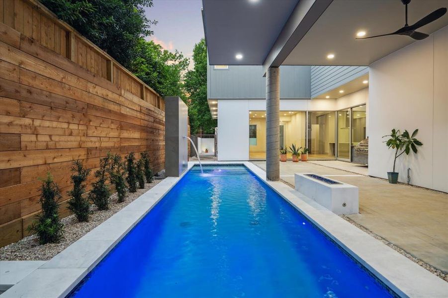 Beautifully designed backyard with Lap Pool and outdoor Kitchen.