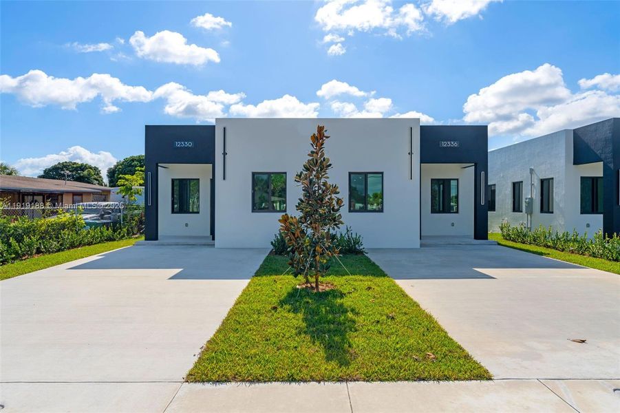 Front exterior of a new home in , Miami, FL, highlighting curb appeal (Image 17).