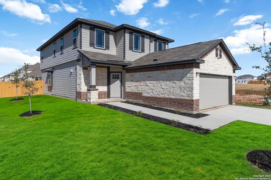 Front exterior of a new home in Applewhite Meadows, San Antonio, TX, highlighting curb appeal (Image 1). Front exterior of a new home in Applewhite Meadows, San Antonio, TX, highlighting curb appeal (Image 1).