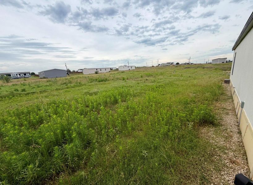 Expansive undeveloped lot featuring natural ground cover