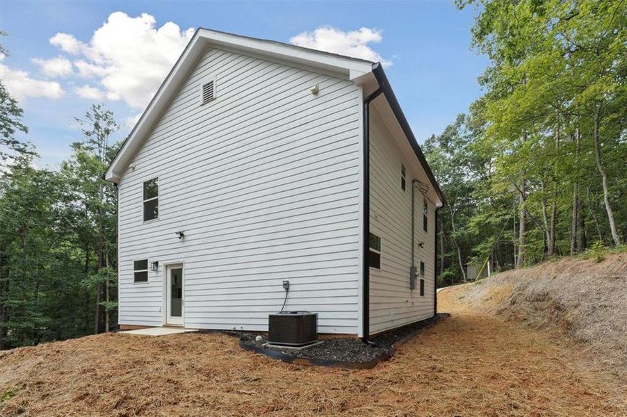 Front exterior of a new home in , Gainesville, GA, highlighting curb appeal (Image 17).