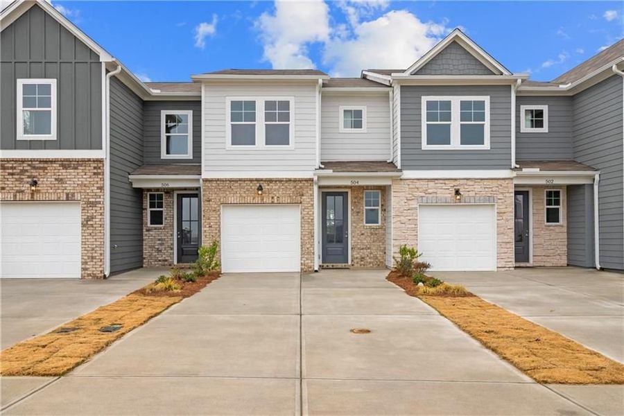 Front exterior of a new home in Stegall Village, Cartersville, GA, highlighting curb appeal (Image 17). Front exterior of a new home in Stegall Village, Cartersville, GA, highlighting curb appeal (Image 17).