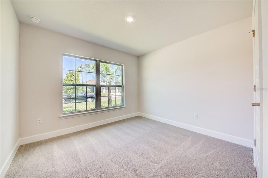 Spacious, unfurnished interior of a new home in Aviary at Rutland Ranch, Parrish (Image 13).