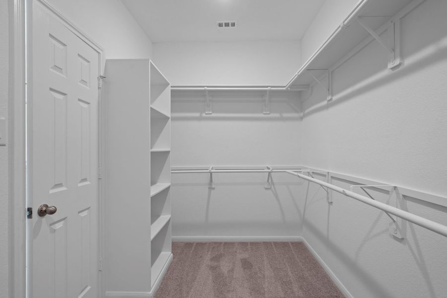 A view of your large primary walk-in Closet