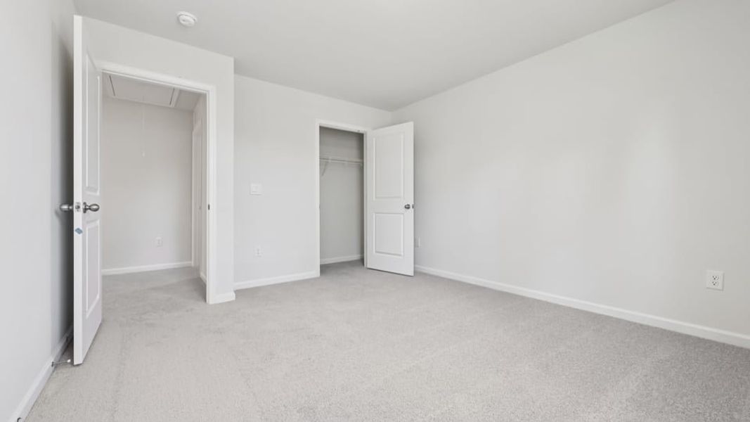 Spacious, unfurnished interior of a new home in Gretchen Pines, West End (Image 24).