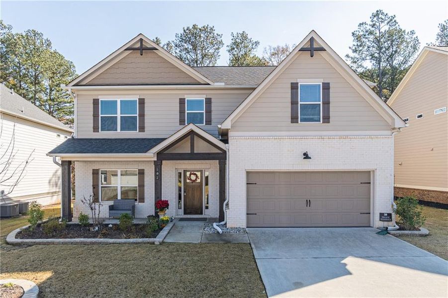 Front exterior of a new home in Enclave at Brookside Crossing, Auburn, GA, highlighting curb appeal (Image 2).