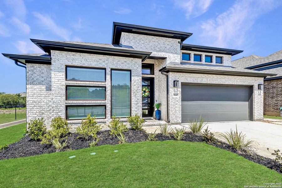 Front exterior of a new home in , Bulverde, TX, highlighting curb appeal (Image 1). Front exterior of a new home in , Bulverde, TX, highlighting curb appeal (Image 1).