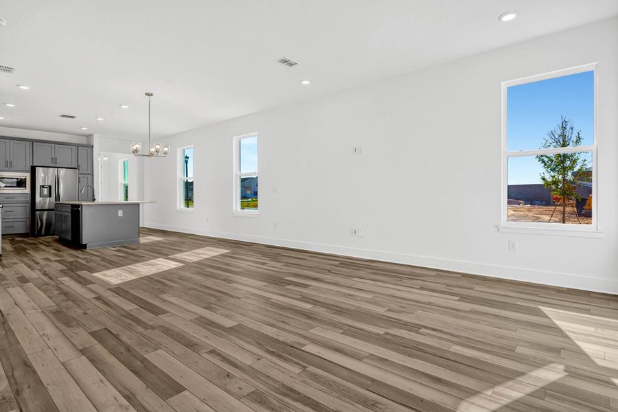 Representative unfurnished interior of a home built from the Whitney by Rockwell Homes in Harvest at Ovation - Townhomes, Winter Garden (Image 12). Representative unfurnished interior of a home built from the Whitney by Rockwell Homes in Harvest at Ovation - Townhomes, Winter Garden (Image 12).