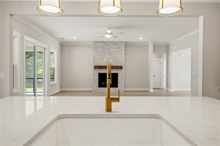 A lustrous golden faucet highlights a pristine cou