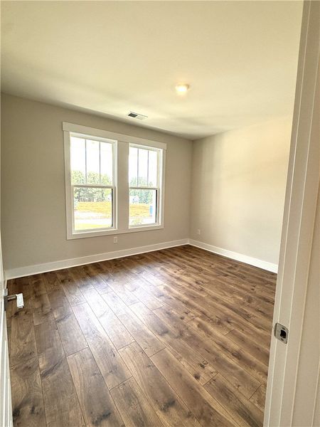 Rich flooring and dual windows define this invitin Rich flooring and dual windows define this invitin