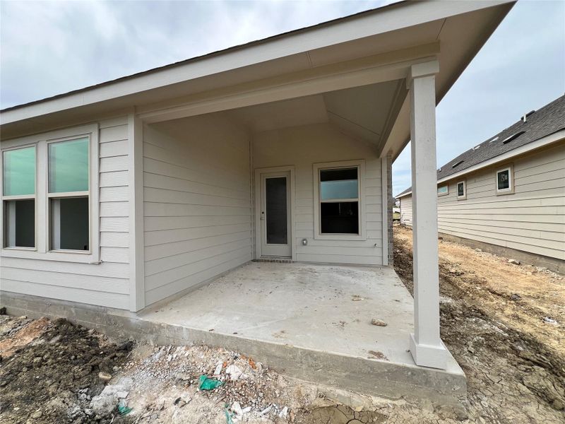 Doorway to property featuring a patio