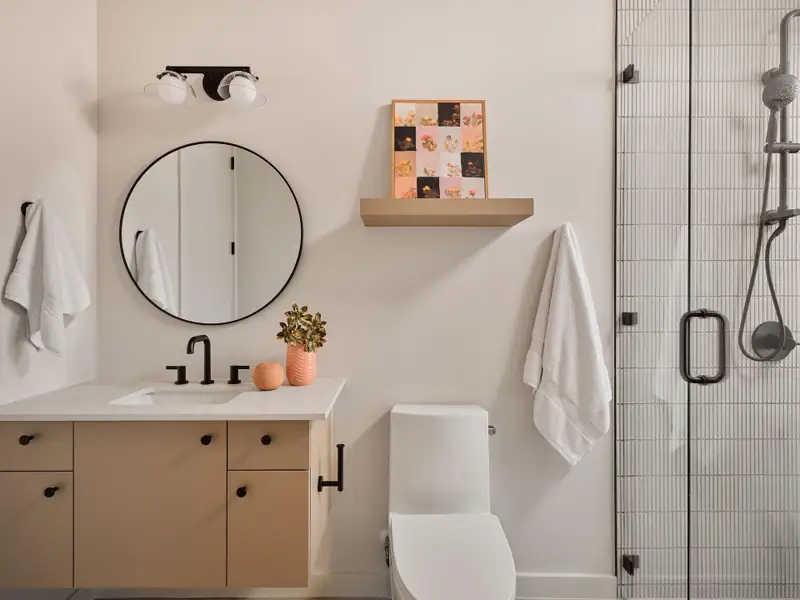 Full bathroom with vanity and a stall shower