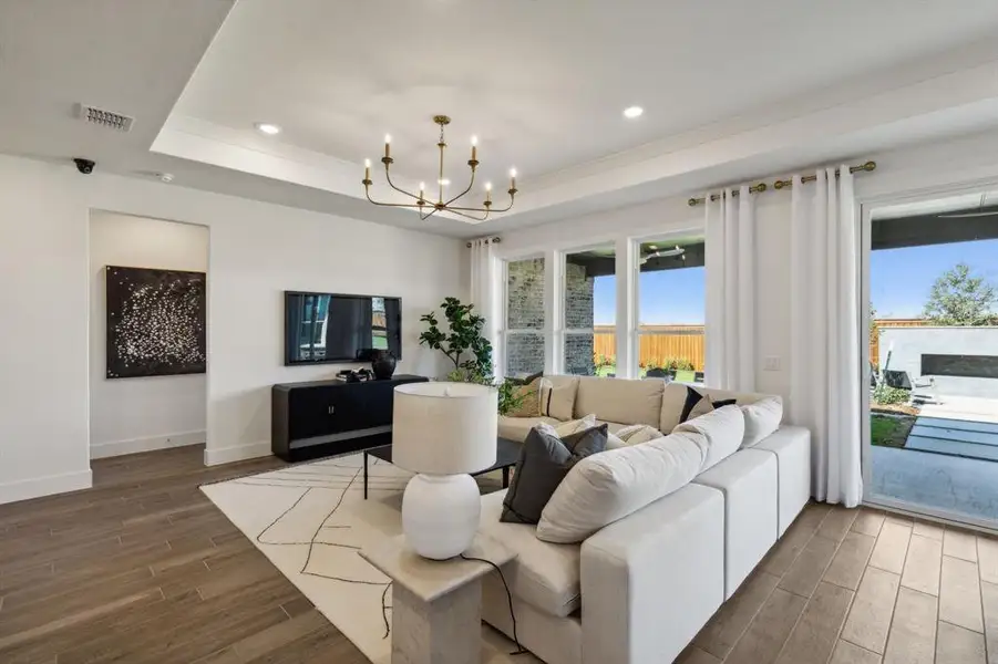 Model Representation* - Spacious gathering room with large windows