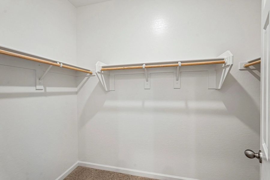 Primary walk in closet Primary walk in closet