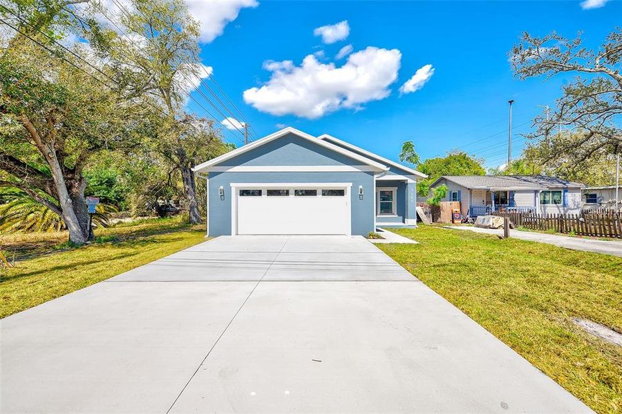 Front exterior of a new home in , St. Petersburg, FL, highlighting curb appeal (Image 27).