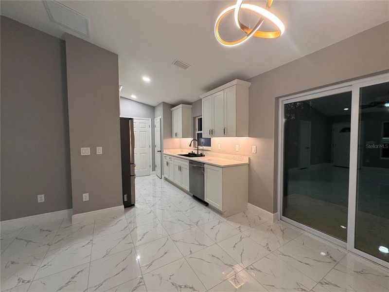 Furnished interior view inside a new home in , Dunnellon (Image 5).